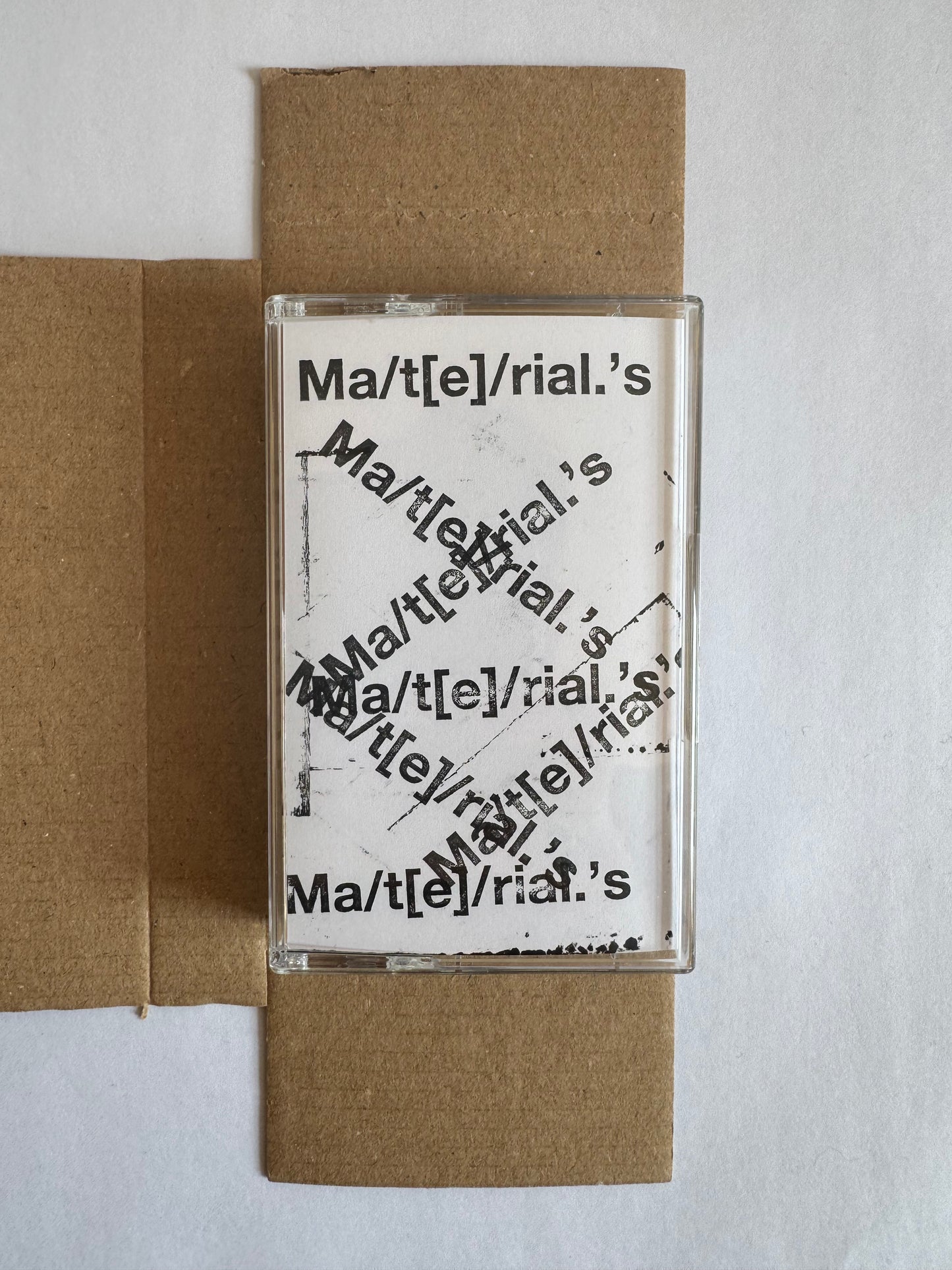 Ma/t[e]/rial.’s mixtape cassette