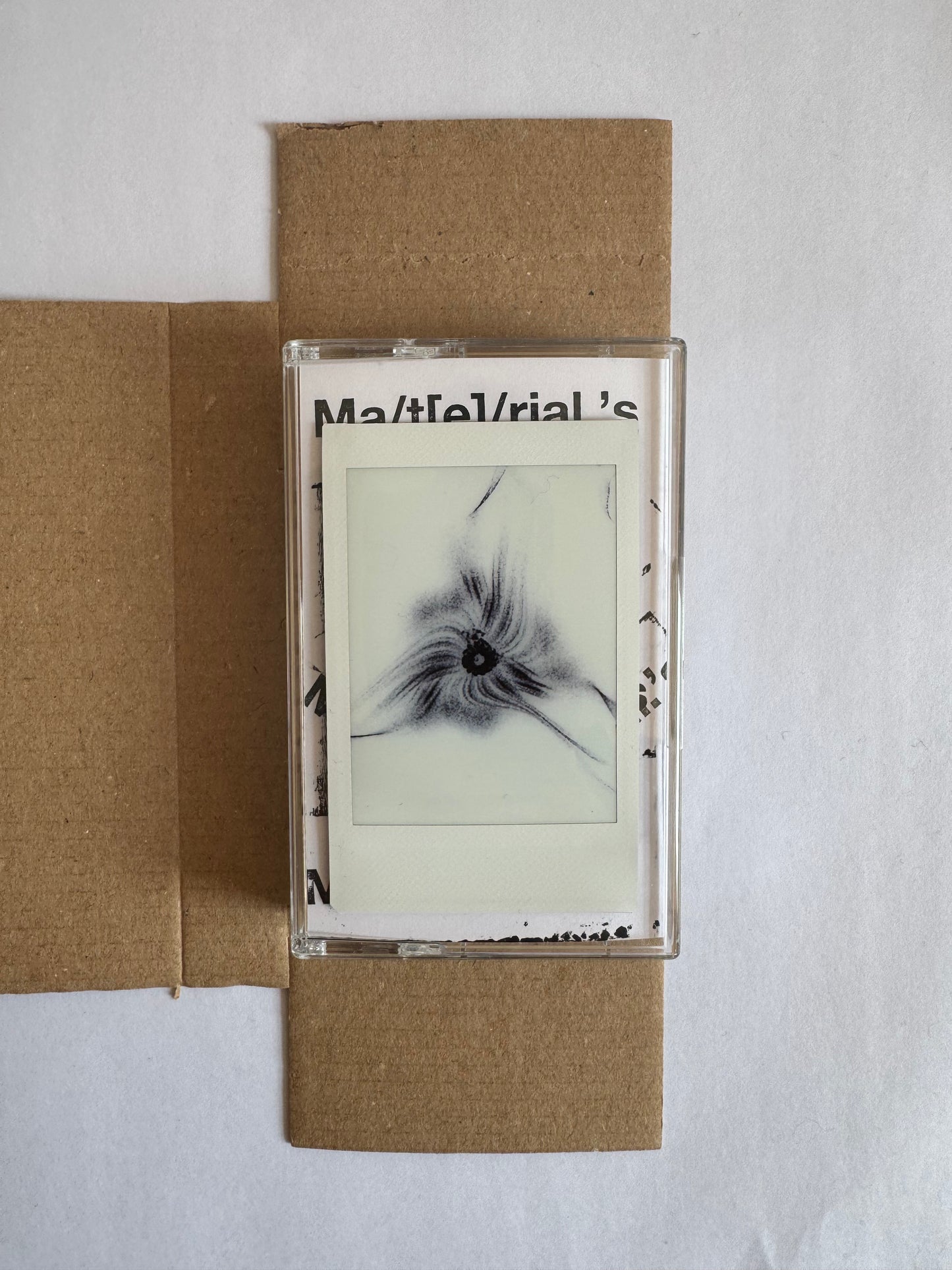Ma/t[e]/rial.’s mixtape cassette
